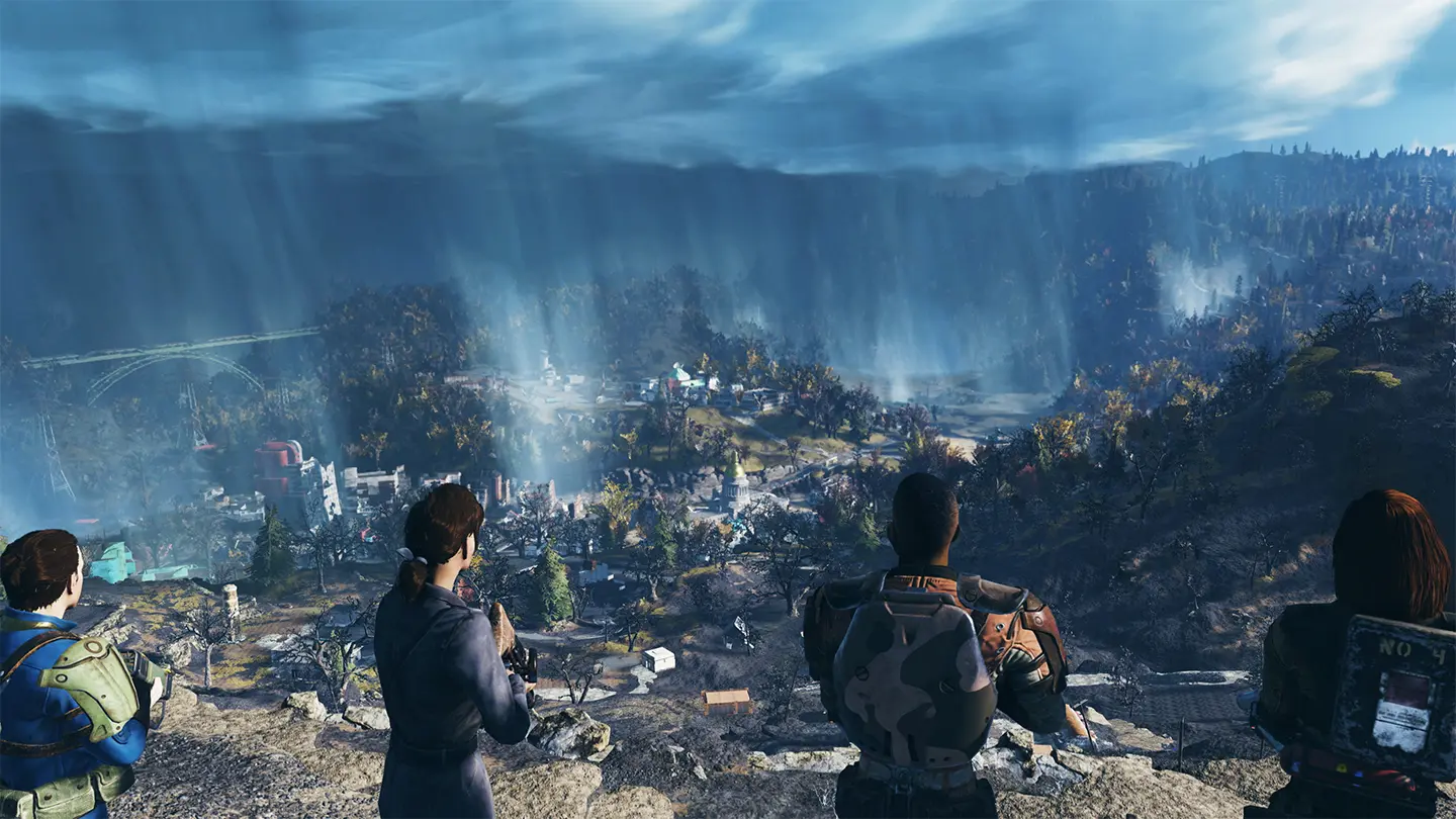 Four players in Fallout 76 looking over a valley with a town and autumn foliage under cloudy skies