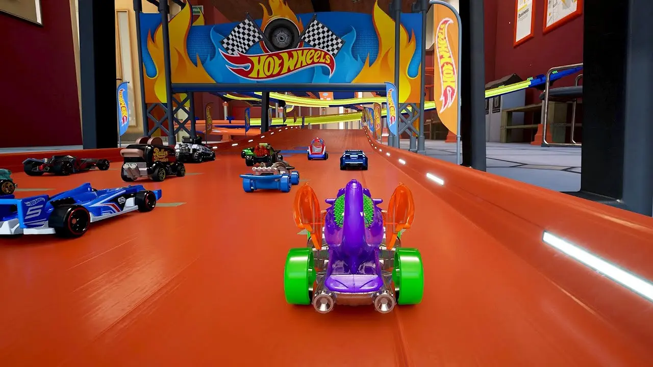 Gameplay screenshot of Hot Wheels Unleashed featuring colorful toy cars racing on an orange track